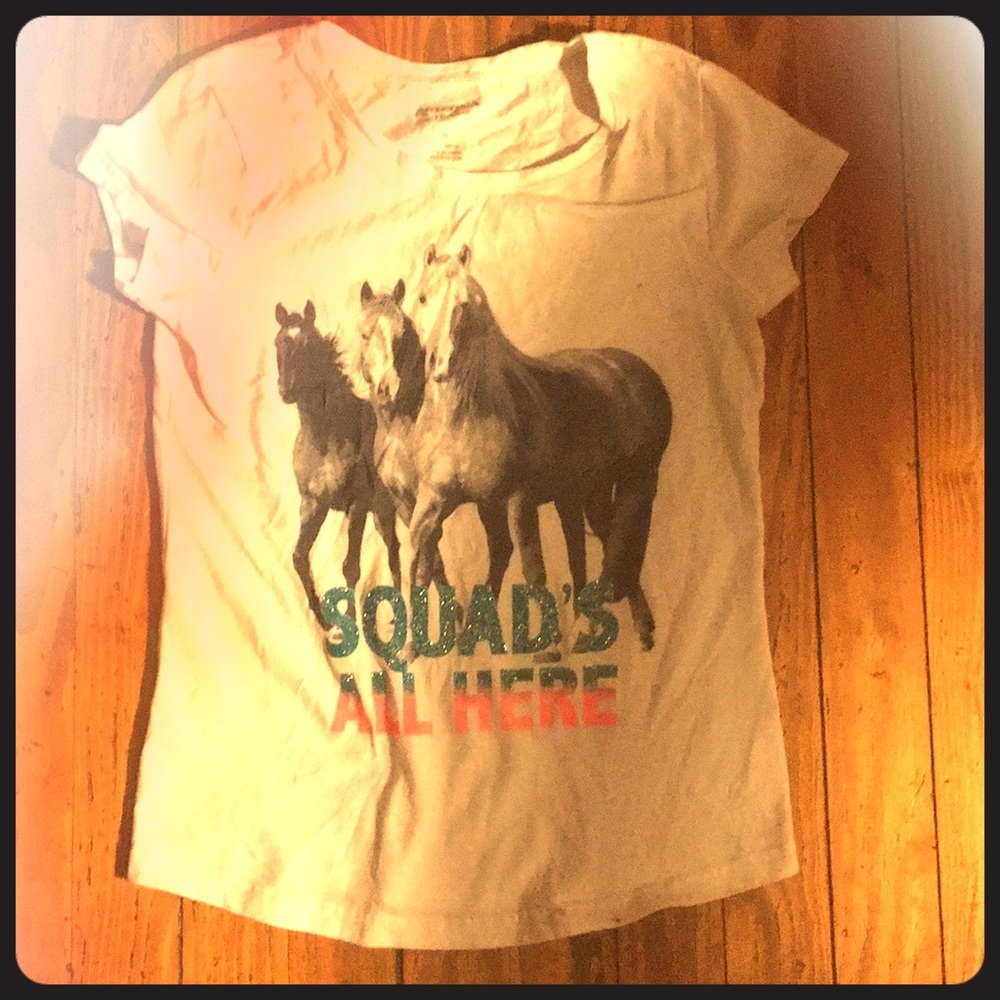 L T shirt Horses on it